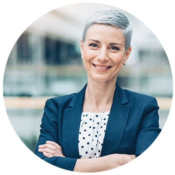 Woman looking at camera smiling ready to assist 