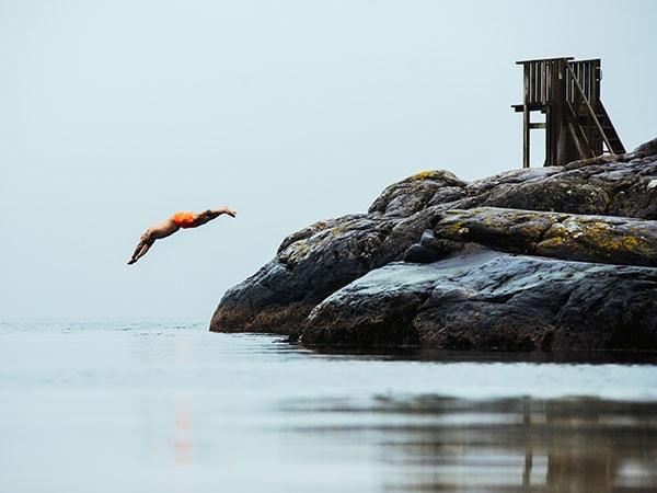 man diving near Bekkjarvik Gjestgiveri
