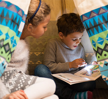 Kids reading in a family friendly room